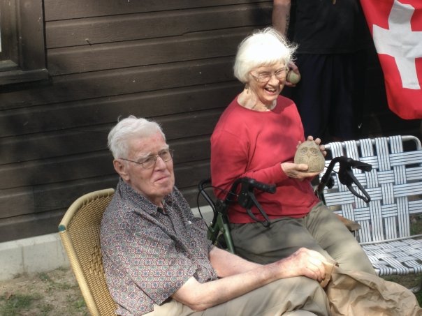 Grandma exclaiming in delight at her rock-owl gift. 